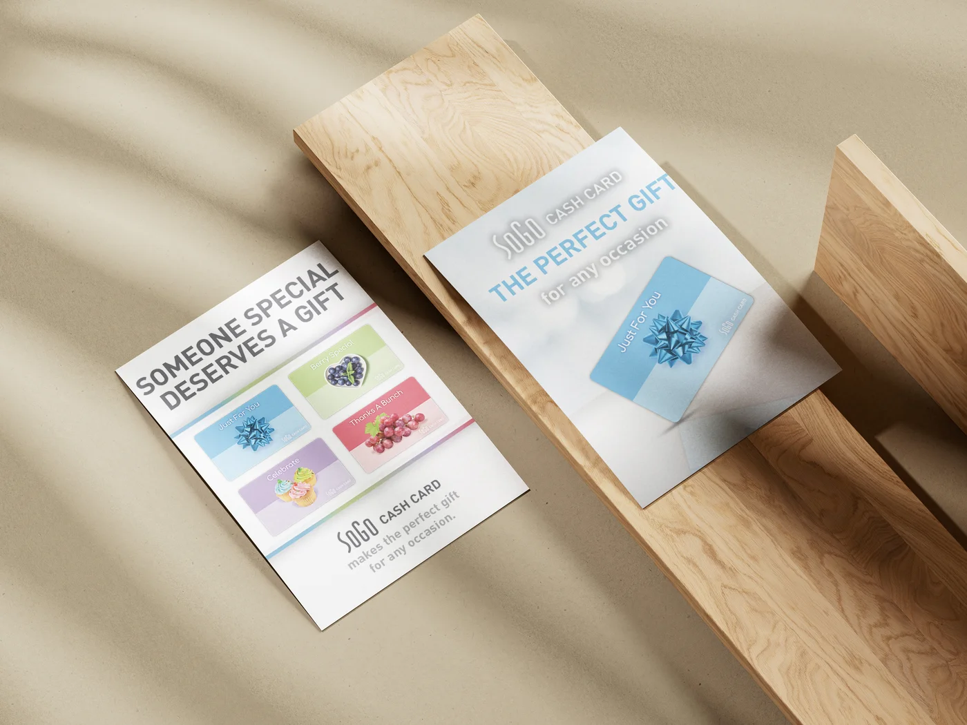 Gift card insert flyer mockup on a wood surface