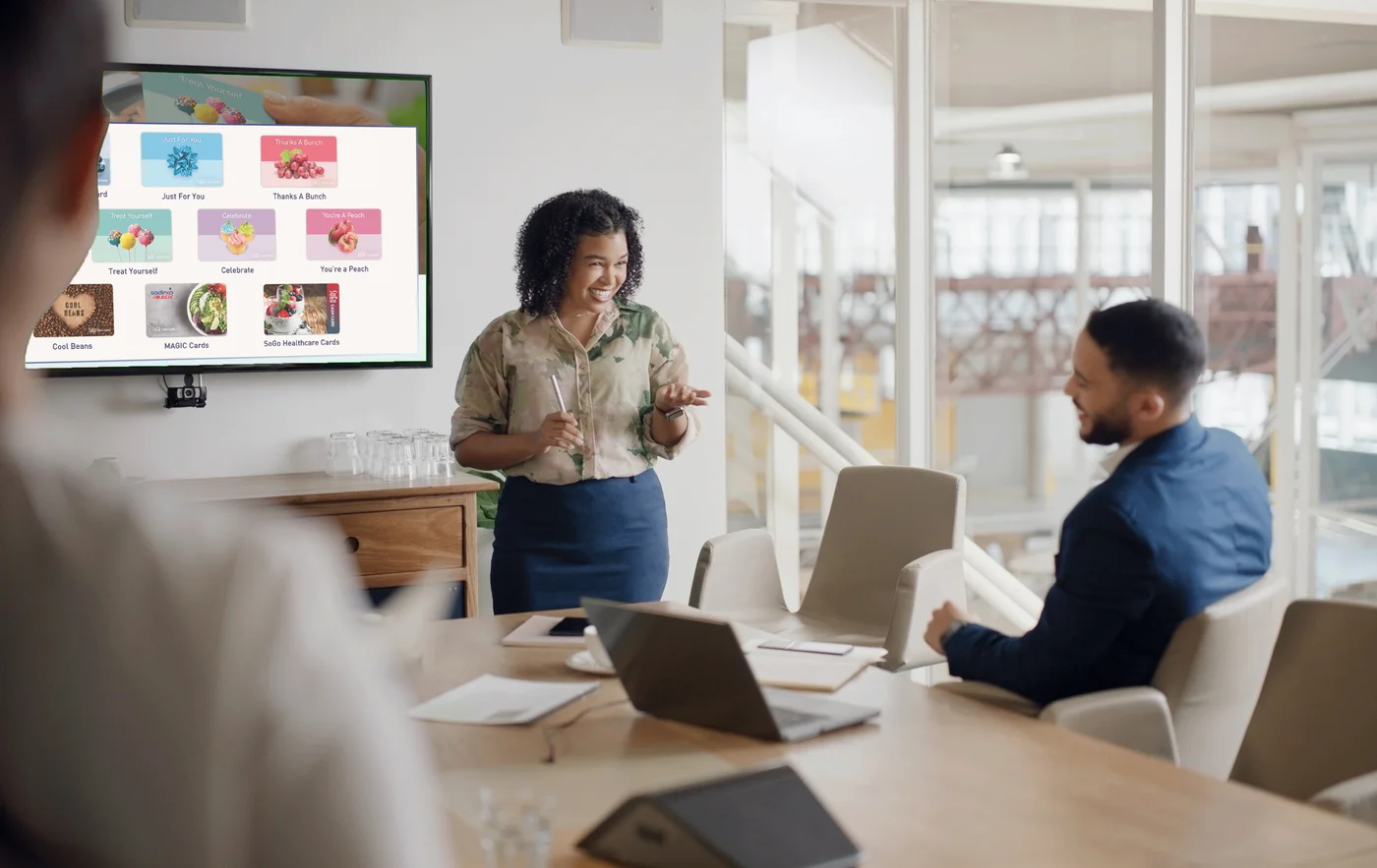 SoGo Cash Card presentation slide displayed on a conference room screen